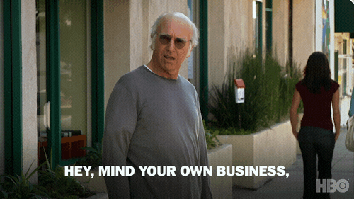 A animated gif from Curb Your Enthusiasm saying Mind your own business