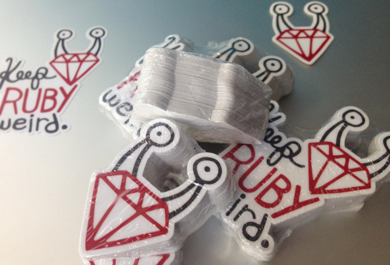 A pile of Keep Ruby Weird stickers